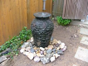 water fountain vase in backyard
